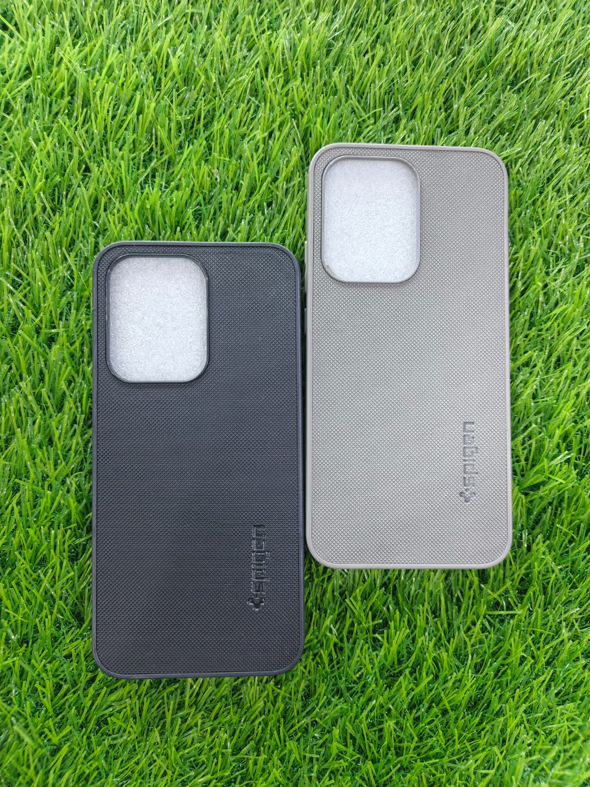 Oppo Reno 13 Spigen design mobile cover in black and grey with square camera cut – hard silicone with soft inner paddin