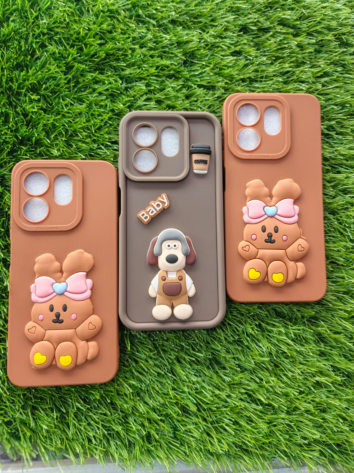 Three phone cases with cartoon designs on a grass background, Cute 3D bunny protective phone case for Infinix Hot 50i & Smart 9